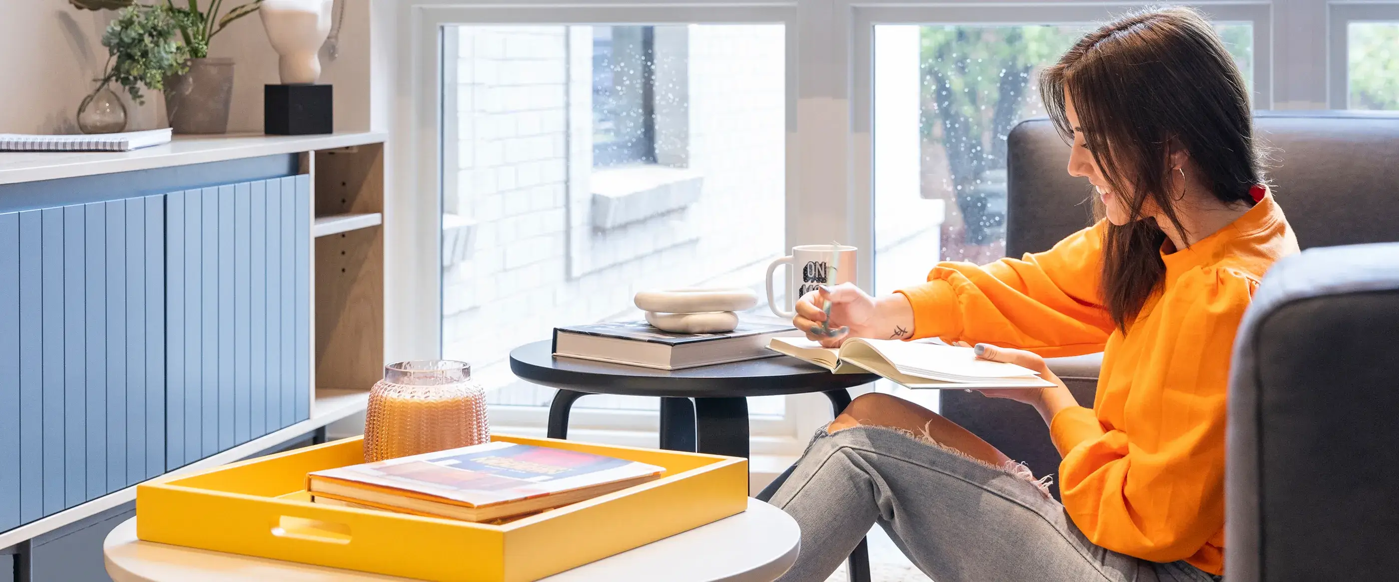 a woman sitting and reading a book